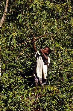 Boy and bow Fergusson island Papua New Guinea