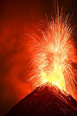 Volcán de Fuego (Volcano of fire) eruption at night, Sierra Madre de Chiapas, Guatemala.