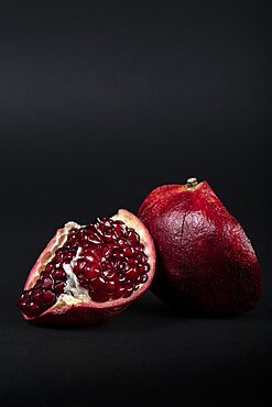 Pomegranate (Punica granatum) on black background