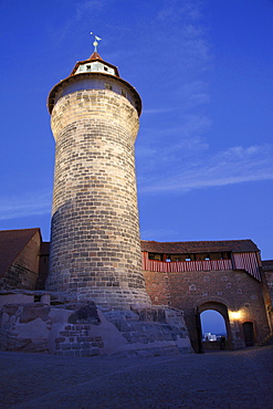 old historical castle Kaiserburg with tower illuminated at night Nuremberg francs Germany