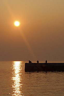 Early Risers, Fishermen at Sunrise,  Babbabcombe, Torquay, South Devon, UK
   (RR)