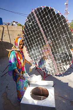 Women constructing solar cookers at the Barefoot College in Tilonia, Rajasthan, India. The Barefoot College is a worldwide charity, founded by Bunker Roy, its aims are, education, drinking water, electrification through solar power, skill development, health, women empowerment and the upliftment of rural people.