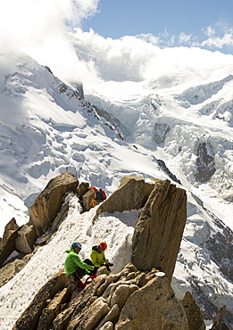 Mont Blanc from the Aiguille Du Midi above Chamonix, France, with climbers on the Cosmiques Arete.