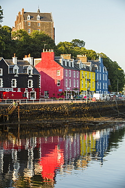 The iconic promenade of Tobermory on the Isle of Mull, Scotland, UK, with its colouful painted shops.