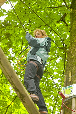 A woman on the the Go Ape aerial challenge in Grizedale Forest in Cumbria, England, United Kingdom, Europe