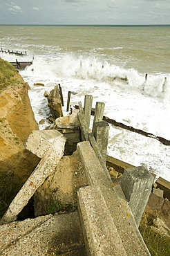 The lifeboat launching ramp destroyed as waves crashing against the coast at Happisburgh on the fastest eroding section of the UK coast, Norfolk, England, United Kingdom, Europe