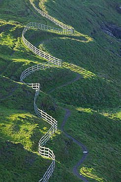 A winding fence and the South West Coast Path near Port Isaac in Cornwall, England, United Kingdom, Europe