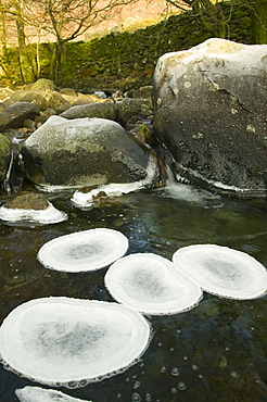 A partially frozen river in Easedale near Grasmere in the Lake District National Park, Cumbria, England, United Kingdom, Europe