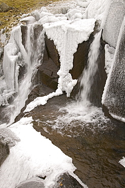 Gale force winds in 2008 blew water from a waterfall in Stake Pass back up the hill coating the surrounding area in thick ice, Lake District, Cumbria, England, United Kingdom, Europe