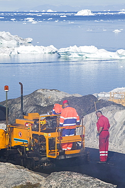 Laying tarmac on a road in Ilulissat on Greenland, Polar Regions