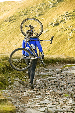 Mountain biker on the Walna Scar road above Coniston in the Lake District, Cumbria, England, United Kingdom, Europe