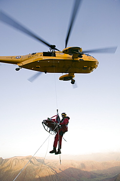 An RAF Sea King helicopter attends a mountain rescue incident in the Lake District, Cumbria, England, United Kingdom, Europe