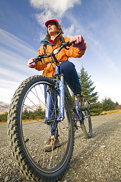 A woman mountain biker in Grizedale forest in the Lake District, Cumbria, England, United Kingdom, Europe