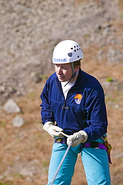 A member of Langdale Ambleside Mountin rescue team abseiling, Cumbria, England, United Kingdom, Europe