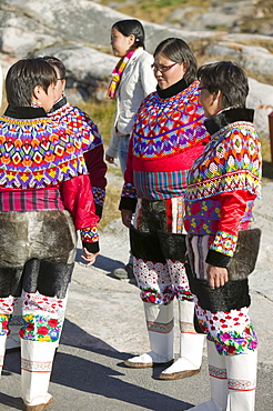 Inuit women wearing traditional Greenlandic national costume (Kalaallisuut) in Ilulissat on Greenland, Polar Regions