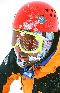 A mountaineer wearing goggles in the Scottish Highlands, Scotland, United Kingdom, Europe