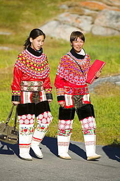 Inuit women wearing traditional Greenlandic national costume (Kalaallisuut) in Ilulissat on Greenland, Polar Regions