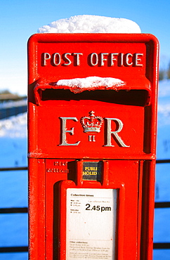 A postbox in snow, Cumbria, England, United Kingdom, Europe