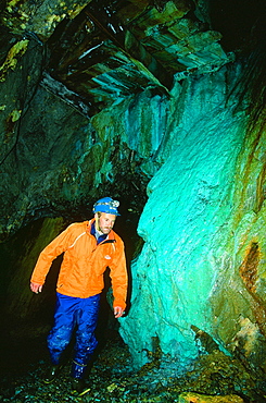 A man exploring the old abandoned Coniston copper mines in the Lake District, Cumbria, England, United Kingdom, Europe