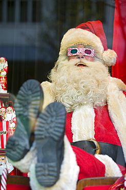 Father Christmas in a window display in a department store on Oxford Street in London, England, United Kingdom, Europe