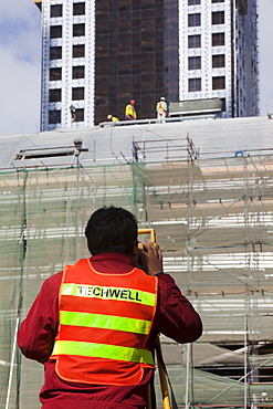 A surveyor working on a construction project in Dubai, United Arab Emirates, Middle East