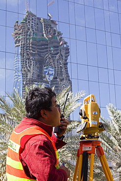 A surveyor working on a construction project in Dubai, United Arab Emirates, Middle East