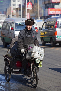 A cyclist on the streets of Suihua in Heilongjiang Province, Northern China, Asia