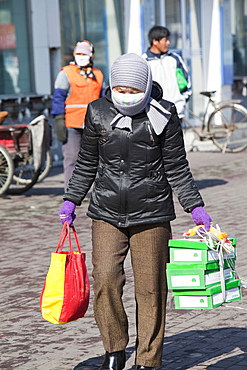 People wear face masks against the awful air pollution in Suihua city, Heilongjiang, Northern China, Asia