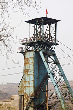 Highly polluted smog hangs over the pit head of a coal mine near Tongshuan in Shanxi province, China, Asia