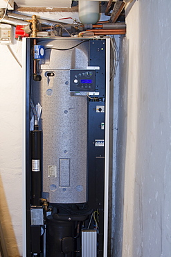 A ground source heat pump with pipes coming up from 55 metres down in a house in Ambleside, Cumbria,, England, United Kingdom, Europe