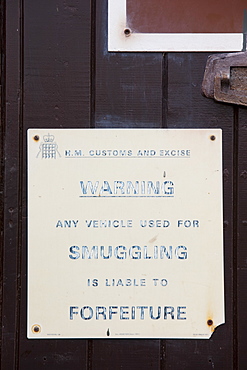 A warning sign to smugglers in Porlock Weir, Somerset, England, United Kingdom, Europe