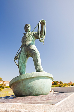 A statue of a young fisherman by local artist Tom Leaper in Newlyn, a memorial to fishermen lost at sea, Cornwall, England, United Kingdom, Europe