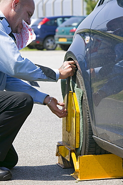 A car clamped at Newquay Airport in Cornwall, England, United Kingdom, Europe