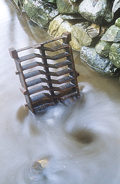 A sewer drain overcome with flood water, Ambleside, Cumbria, England, United Kingdom, Europe