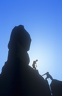 Climbers on Napes Needle, a pinnacle of rock on Great Gable in the Lake District, Cumbria, England, United Kingdom, Europe