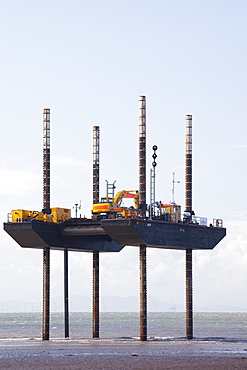 A jack up barge laying the onshore electricity cable from the offshore wind farm, Robin Rigg, in the Solway Firth, north of Workington, Cumbria, England, United Kingdom, Europe