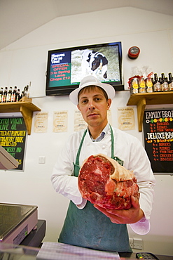 Paul Harrison butchering at Plumgarths farm shop in Kendal, Cumbria, England, United Kingdom, Europe