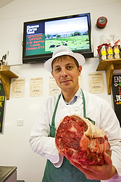 Paul Harrison butchering at Plumgarths farm shop in Kendal, Cumbria, England, United Kingdom, Europe