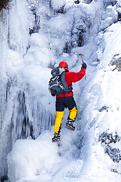 The mountaineer, Mike Withers, ice climbing in Fisher Place gill above Thilrmere in the Lake District, Cumbria, England, United Kingdom, Europe