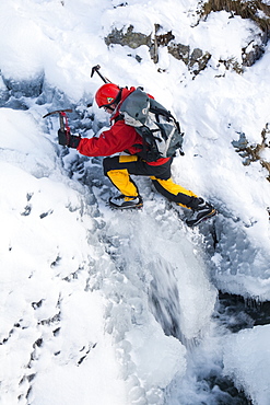 The mountaineer, Mike Withers, ice climbing in Fisher Place gill above Thilrmere in the Lake District, Cumbria, England, United Kingdom, Europe