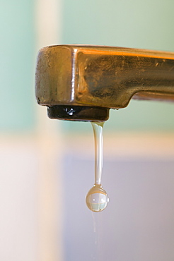 Water dripping from a household tap