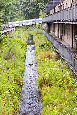 An urban river channeled to run through the centre of Burnley in Lancashire, England, United Kingdom, Europe