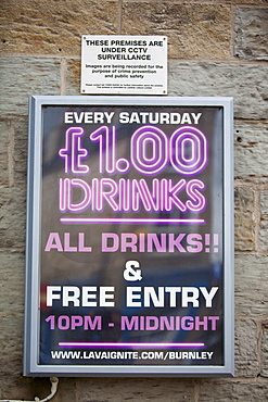 Cheap drink promotion adverts outside a nightclub in Burnley, Lancashire, England, United Kingdom, Europe