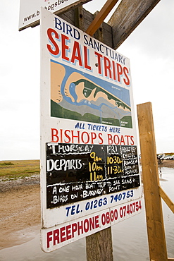 An advert for a seal watching boat trip at Blakeney, in north Norfolk, England, United Kingdom, Europe