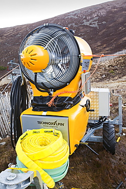 A snow machine in the Cairngorms, surrounded by bare slopes, after poor snow falls in March 2012, Scotland, United Kingdom, Europe