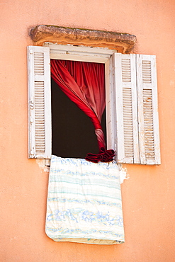 Bedding hanging out of a window in Marrakech, Morocco, North Africa, Africa