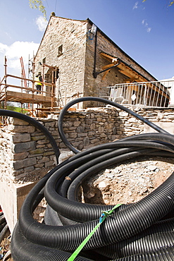 Piping for the ground source heat pump at the Hyning in Grayrigg, an old farmhouse and barns being converted into eight holiday letting properties, near Kendal, Cumbria, England, United Kingdom, Europe