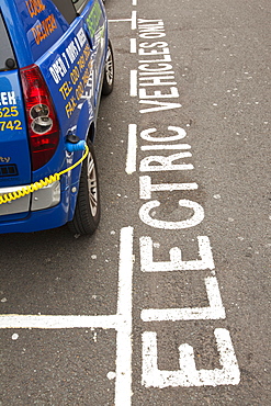 An electric vehicle at a recharging station on the street in Berkeley Square, London, England, United Kingdom, Europe