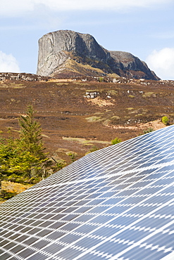 Solar panels in front of An Sgurr on the Isle of Eigg, Scotland, United Kingdom, Europe