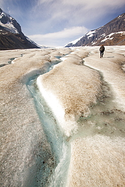 Meltwater channels and tourists on the Athabasca Glacier, Jasper National Park, UNESCO World Heritage Site, Alberta, Canadian Rockies, Canada, North America